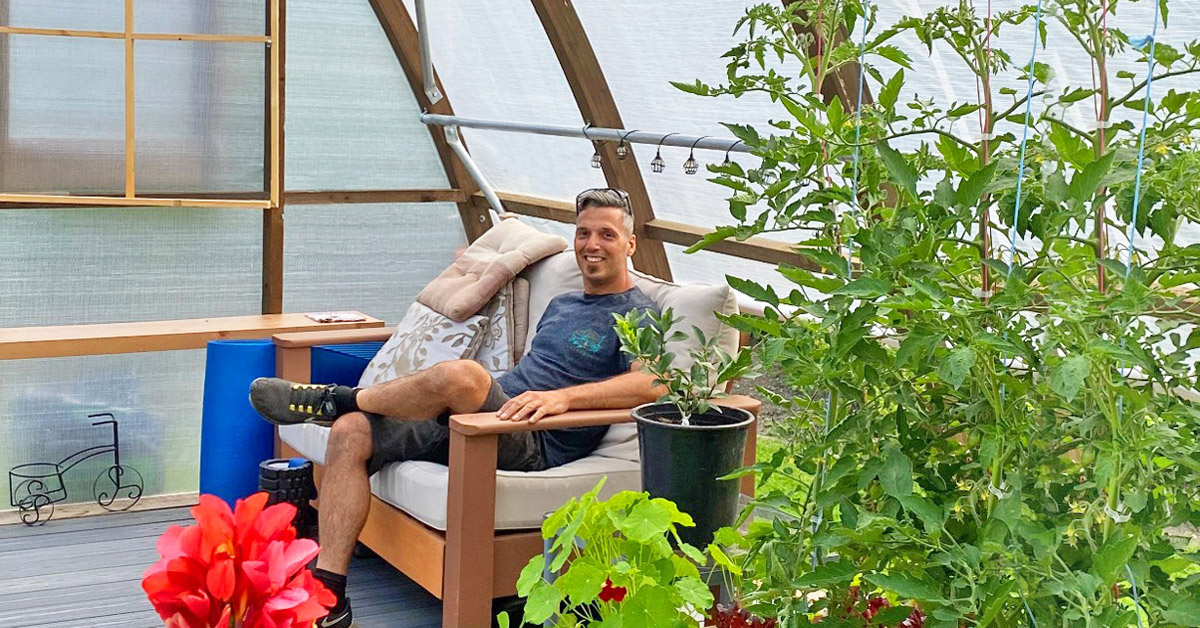 Davide-Luchetta-owner-of-Argenta-Greenhouse-Company-sits-amoung-plants Accessible Greenhouse at Selkirk College